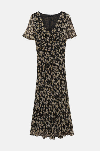 Zwarte jurk met korte mouwen van MANGO, met een all-over madeliefjesprint en een vloeiende rok.