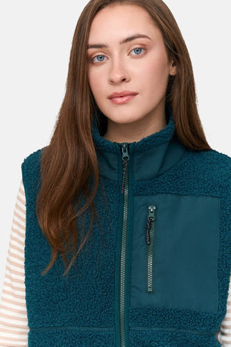 Veste turquoise de 24 couleurs GMBH, avec texture en polaire et poche brodée à fermeture éclair.