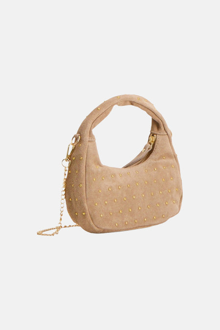 Beige suède-look handtas van Access® met goudkleurige studs, korte handgreep en afneembare kettingriem.