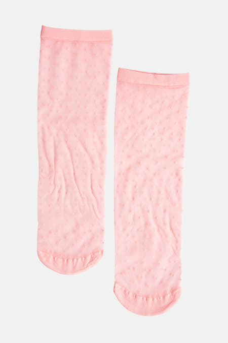 Chaussettes roses d'Astrid Black Label, avec une subtile structure à points et un bord côtelé fin.