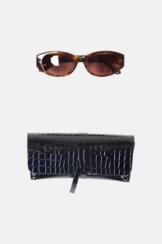 Bruine bril van Astrid Black Label met een zonnebril-montuur.