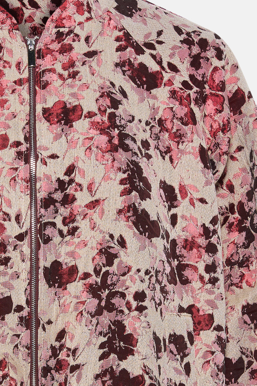 Veste courte rose Astrid Black Label, avec imprimé floral et fermeture éclair argentée.