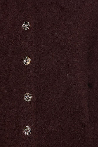 Gilet brun d'Astrid Black Label avec des boutons en argent.