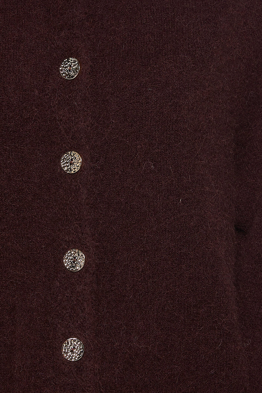 Gilet brun d'Astrid Black Label avec des boutons en argent.