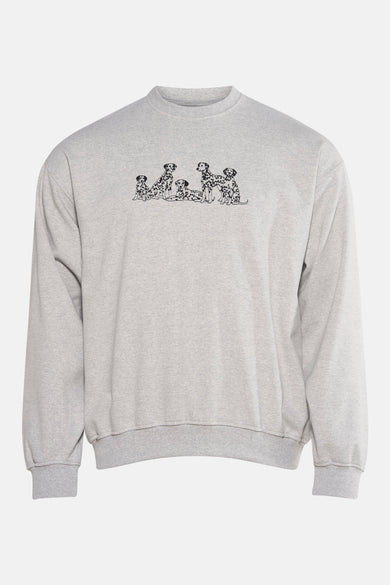 Grijze sweater van KAOTIKO, met een print van dalmatiërs op de borst.

