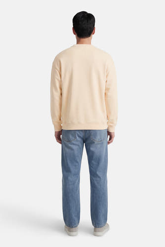 Pull écru de KAOTIKO, manches longues et col rond au dos.