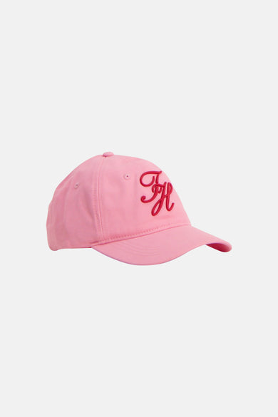 Casquette rose TOMMY JEANS avec un logo 'FH' rouge brodé sur le devant, de profil.