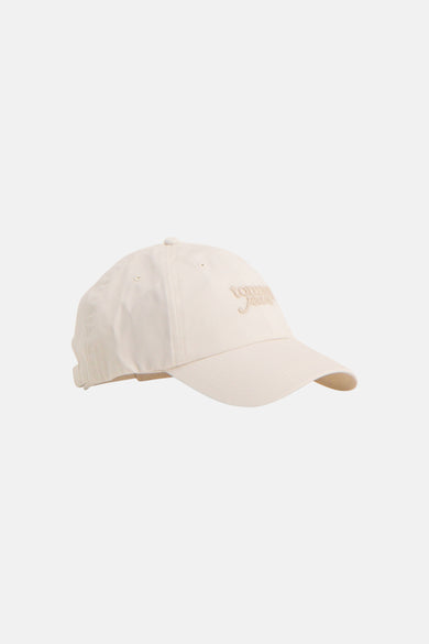 Ecru pet van TOMMY JEANS met geborduurd logo, zijwaarts weergegeven, eenvoudig en casual design