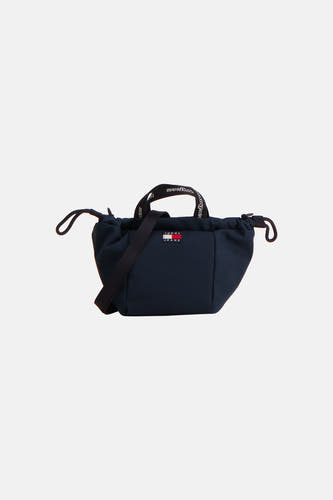Donkerblauwe handtas van TOMMY JEANS met logo-patch, trekkoord sluiting en schouderband, front view
