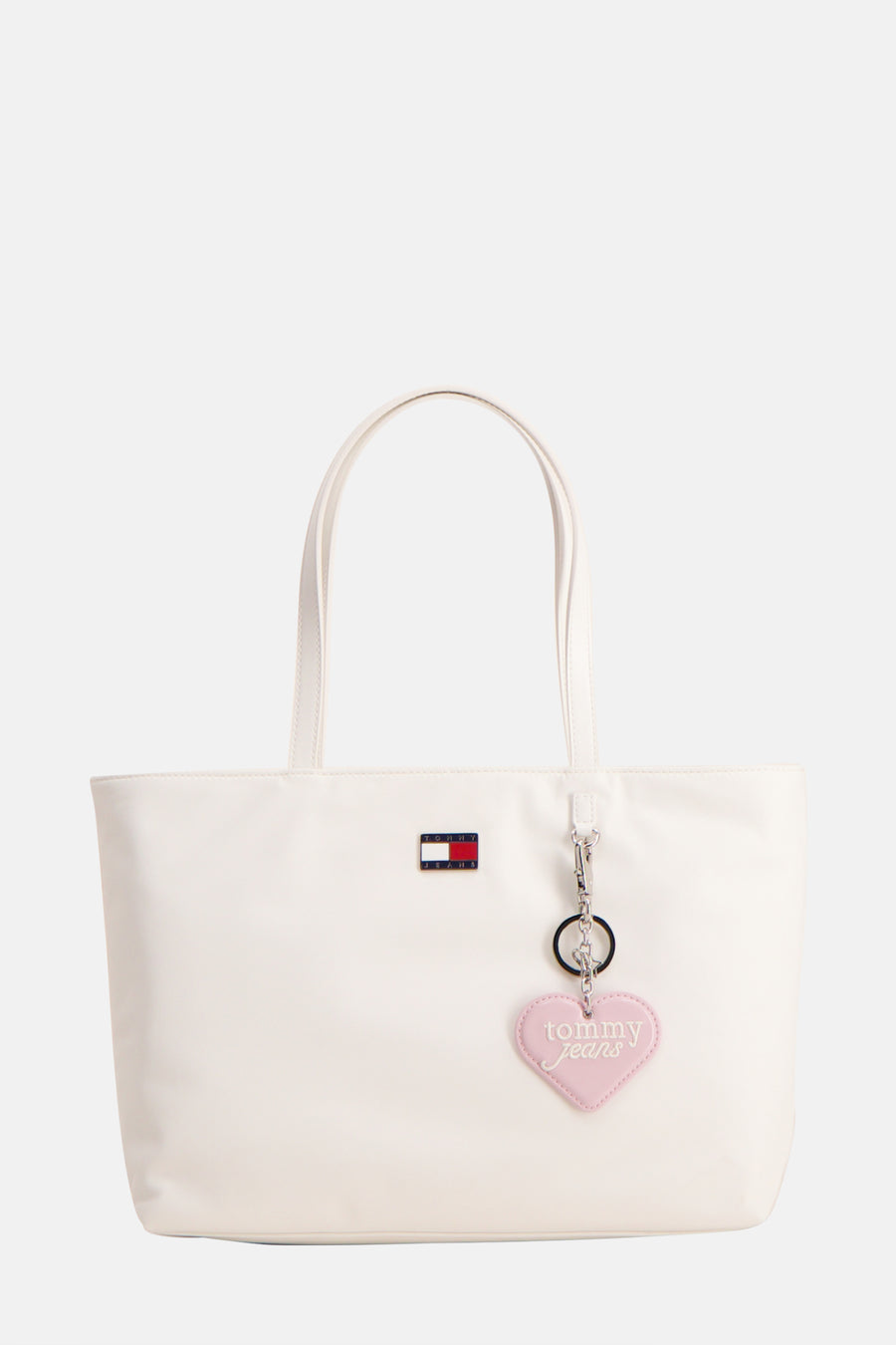 Witte schoudertas van TOMMY JEANS met hartvormige hanger en logo.