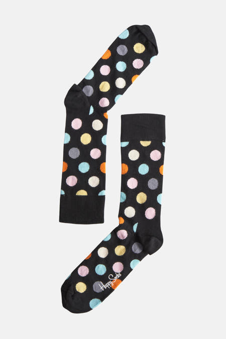 Multikleurige sokken van Happy Socks, met een stippenpatroon in blauw, roze, geel, oranje, grijs en wit.
