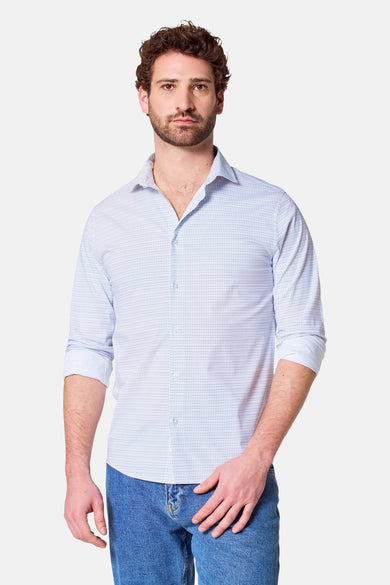 Man met bruin haar, lichtblauw overhemd en blauwe jeans.