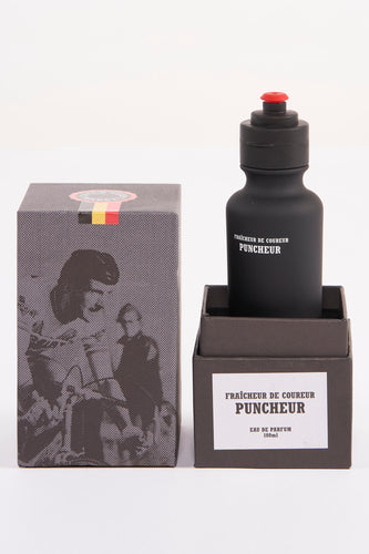 Zwarte parfumfles en grijze verpakking.