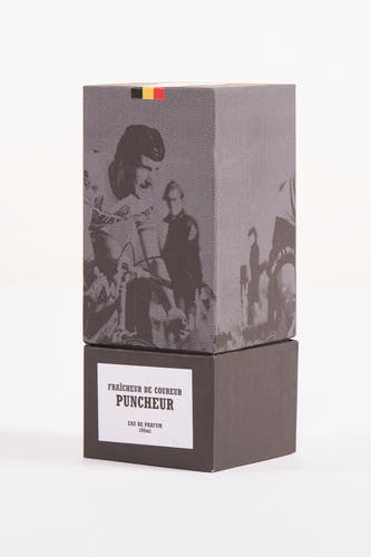 Zwarte parfum van Cyclo Club Marcel, met een rasterpatroon en een Belgische vlag aan de bovenkant van de doos.
