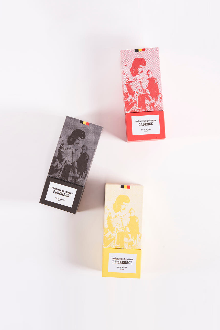 Parfum noir de Cyclo Club Marcel, avec une image vintage et un emballage rectangulaire en rouge, jaune et noir.