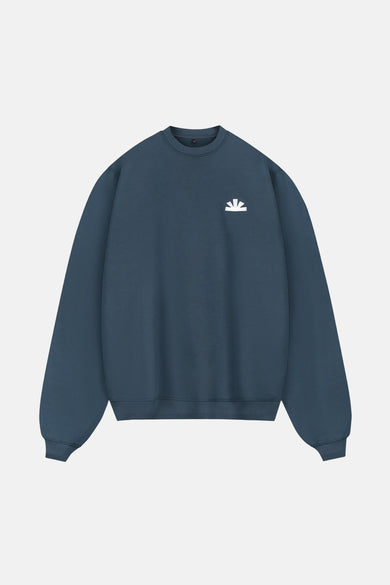 Gilet bleu de BASELAB, avec un logo blanc sur la poitrine.