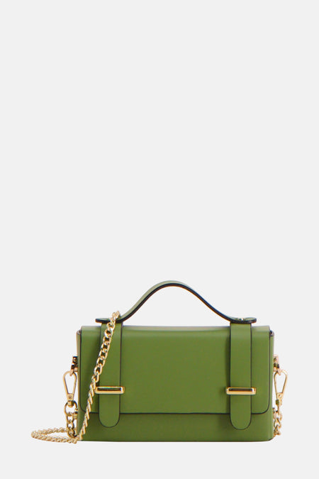 Sac à main vert de Clouds of Fashion avec des strass dorés et une poignée.