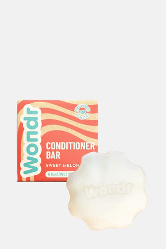 Conditionneur barre sucrée pastmelon de WONDR CARE, avec un design ondulé sur l'emballage.