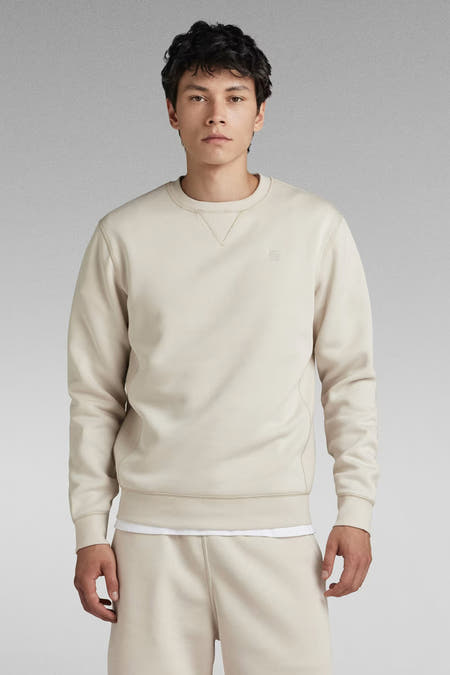 Gilet écru de G-Star RAW, avec un col rond et un logo subtil sur la poitrine.