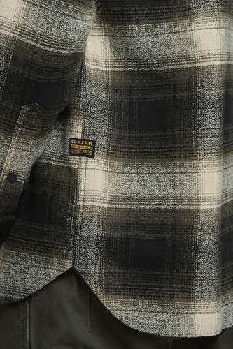 Veste verte de G-Star RAW avec un motif à carreaux et une fermeture à boutons visible.