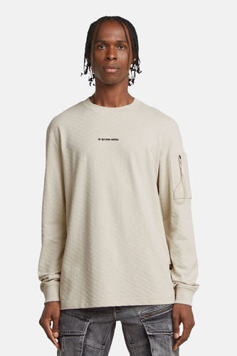 Ecru sweater van G-Star RAW met lange mouwen en een klein zakje met rits.