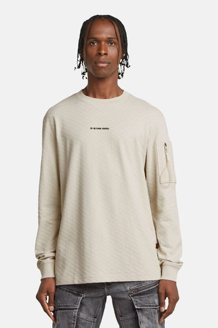 Ecru sweater van G-Star RAW met lange mouwen en een klein zakje met rits.