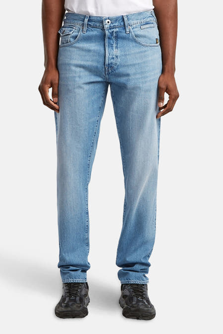 Jean tapered en denim bleu clair de G-Star RAW, avec une fermeture à boutons et des détails subtils.