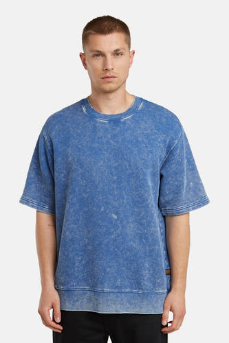 Blauwe sweater van G-Star RAW met korte mouwen en een verwassen textuur.
