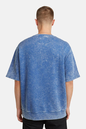 Blauwe sweater van G-Star RAW, met een gewassen textuur en korte mouwen, gezien van achteren.