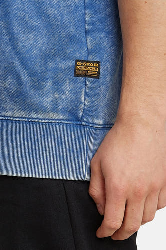 Blauwe sweater van G-Star RAW, met een acid wash effect en een geribde boord.
