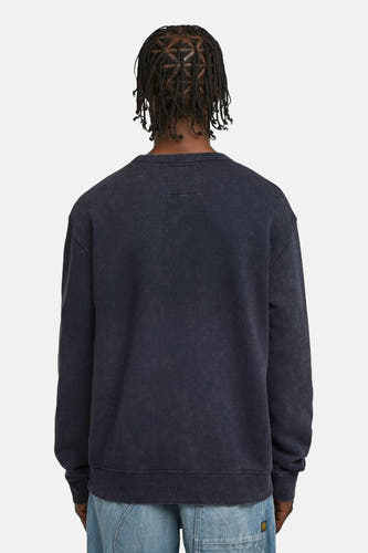Blauwe sweater van G-Star RAW, achteraanzicht, met een stonewash textuur en een vierkant etiket.