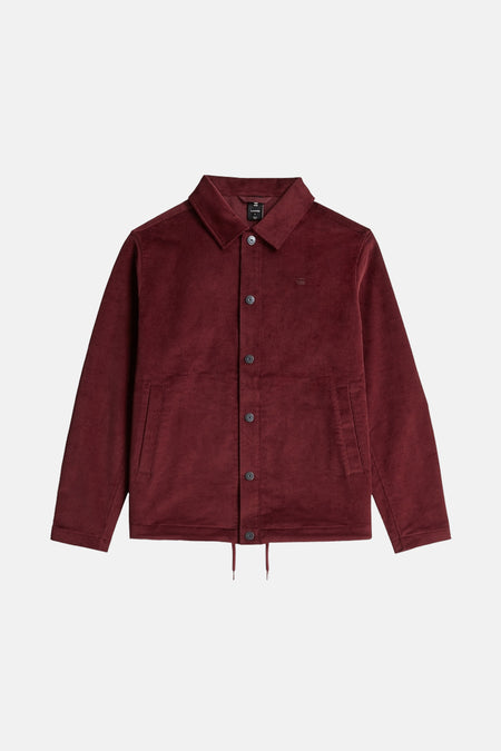 Donkerrood corduroy jack met knoopsluiting en kraag.