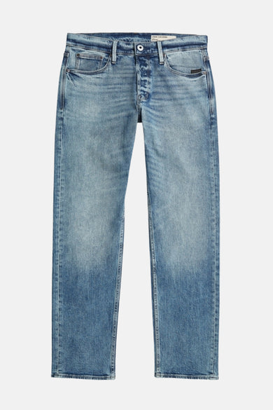 Jeans tapered in blauw denim van G-Star RAW, met een stonewashed wassing en knoopsluiting.
