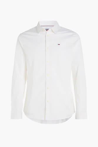 Chemise blanche à manches longues de TOMMY JEANS, avec col boutonné et logo brodé.