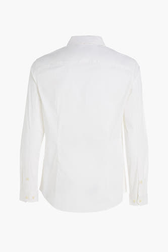 Chemise blanche à manches longues de TOMMY JEANS, tissu uni et col boutonné.
