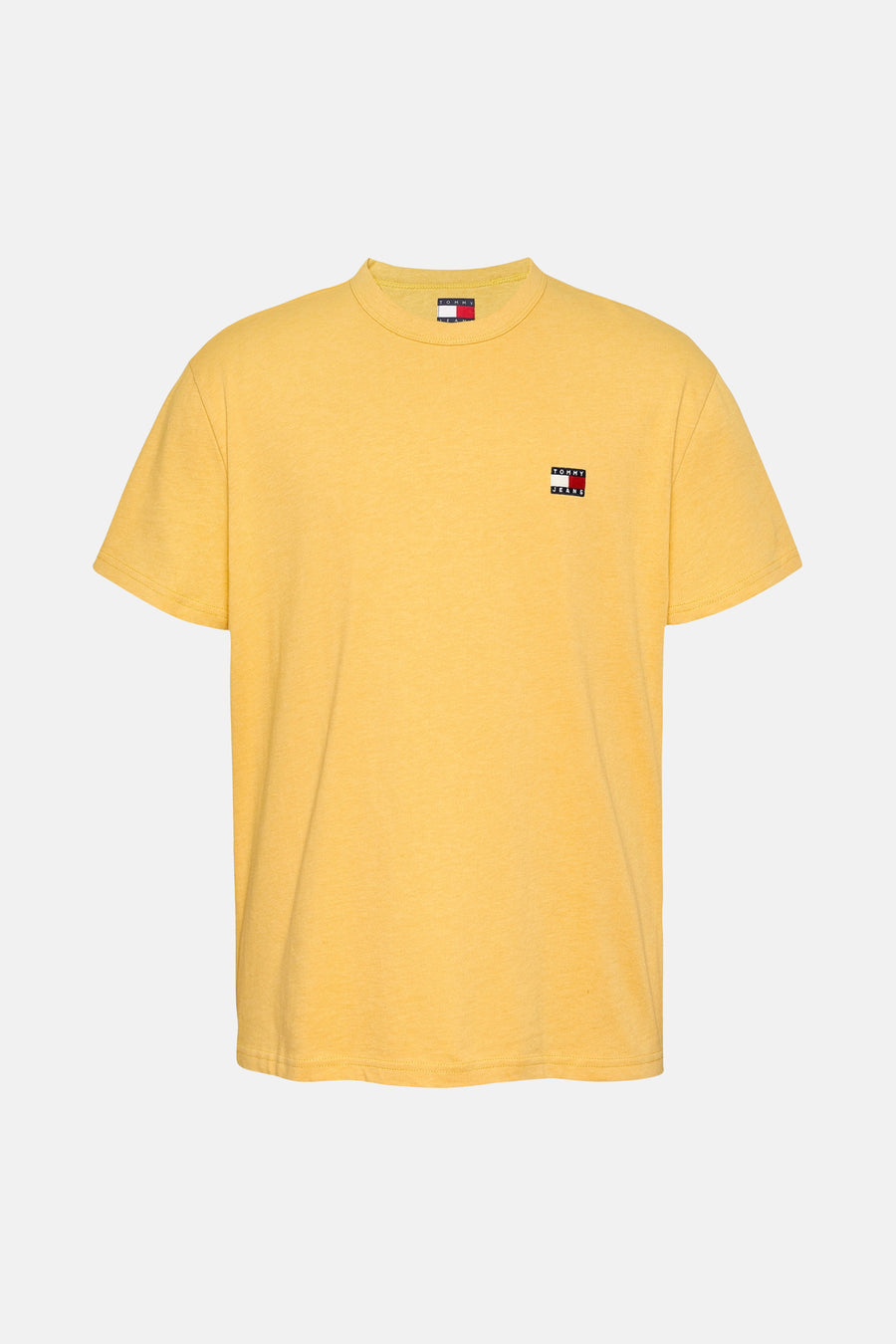 T-shirt jaune à manches courtes de TOMMY JEANS, avec le logo sur la poitrine.