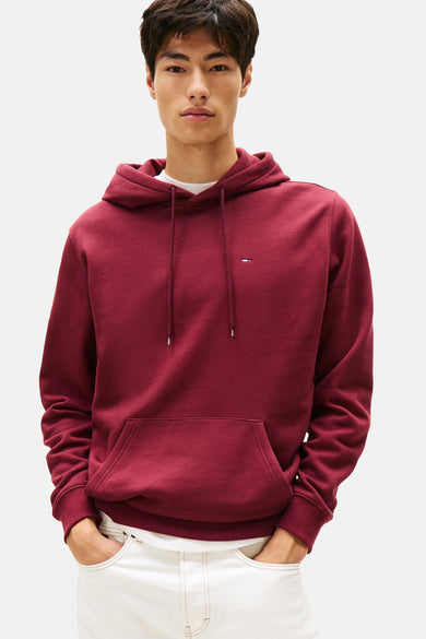 Gilet de Bordeaux avec capuche Tommy Jeans, avec des cordons et une poche sur l'avant.