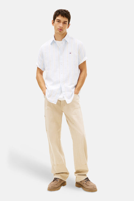 Blauw gestreept overhemd met korte mouwen van Tommy Jeans, met een losse pasvorm en opgerolde mouwen.