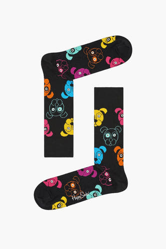 Multikleurige sokken van Happy Socks met een opvallend, kleurrijk hondenmotief tegen een zwarte achtergrond.