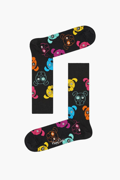 Multikleurige sokken van Happy Socks met een opvallend, kleurrijk hondenmotief tegen een zwarte achtergrond.
