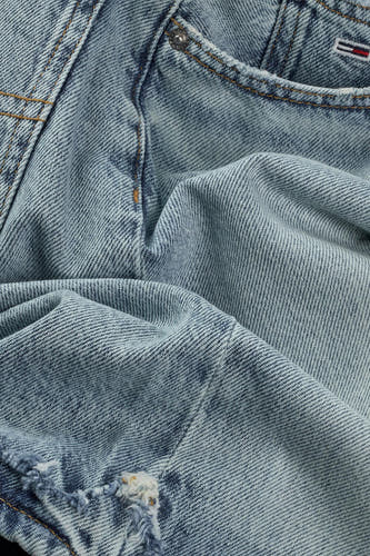 Short light blue denim pants from TOMMY JEANS, with a striking, fringed edge and texture.