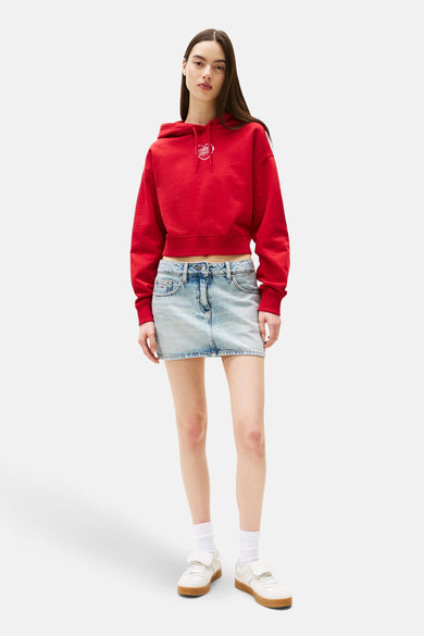 Gile rouge de TOMMY JEANS, avec des manches longues, un capuchon et une impression sur la poitrine.