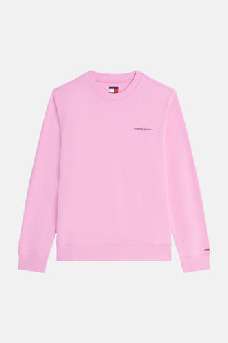 Pull rose à col rond de TOMMY JEANS, avec petit logo 'tommy jeans' et étoile sur la poitrine et logo drapeau sur le poignet.