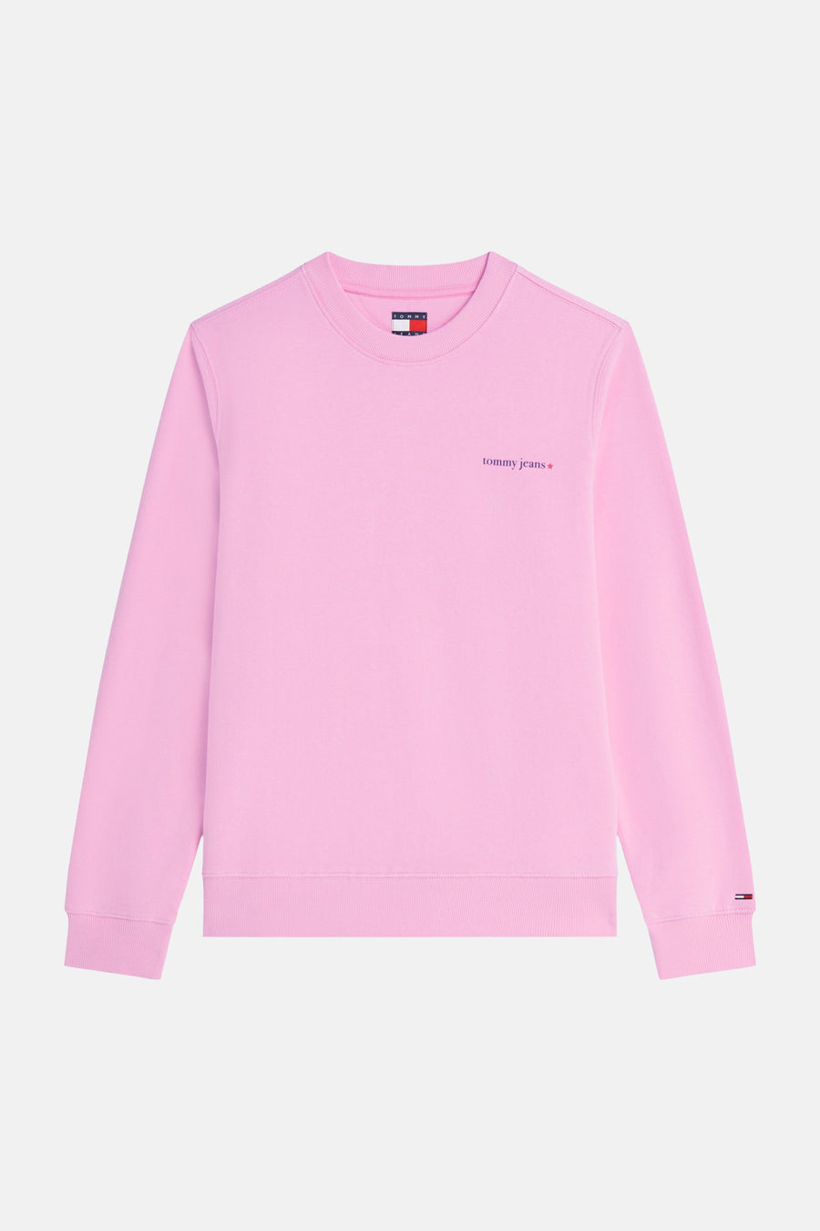 Pull rose à col rond de TOMMY JEANS, avec petit logo 'tommy jeans' et étoile sur la poitrine et logo drapeau sur le poignet.