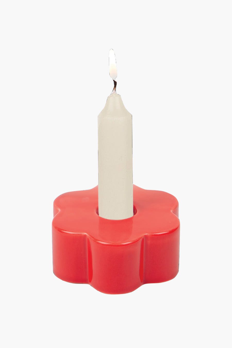 Rode cadeauset van DOIY met een bloemvormige kaarsenhouder en een witte kaars met vlam.
