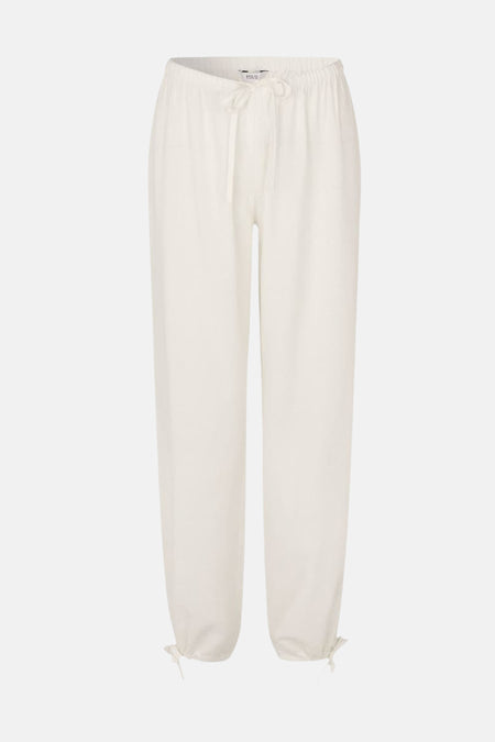 Pantalon blanc ample d'ENVII avec taille élastique et cordons de serrage aux chevilles.