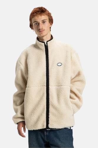 Beige, korte jas van DC SHOES, met een ritssluiting en een logo op de borst.