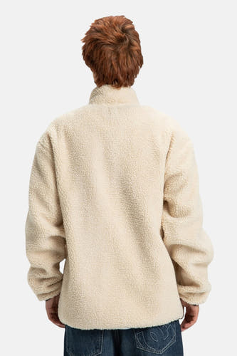 Beige korte jas van DC SHOES, met een wollige textuur, gezien van achteren.
