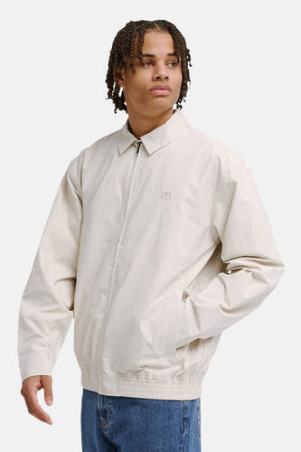 Veste courte beige de DC SHOES, avec manches longues et fermeture éclair sur le devant.