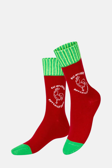 Meerkleurige sokken van EAT MY SOCKS, met een rood design, groene teen en hiel en een logo.